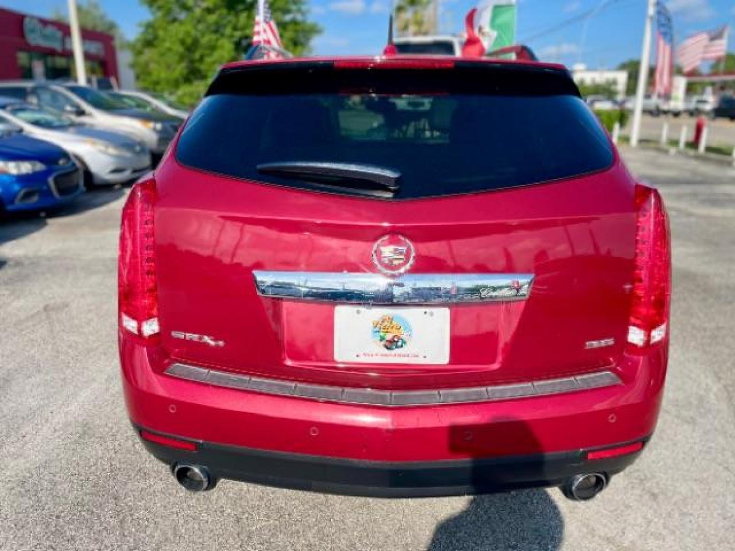 2013 Crystal Red Tintcoat Cadillac SRX AWD Luxury Collectio (3GYFNGE37DS) with an 3.6L V6 DOHC 24V FFV engine, 6-Speed Automatic transmission, located at 4545 Spencer Hwy., Pasadena, 77504, (832) 266-1645, 29.666037, -95.173775 - Photo#2