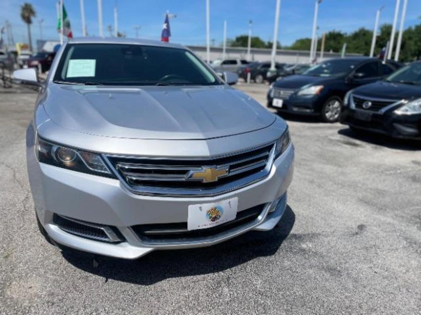 2015 Silver Ice Metallic /Brownstone/Jet Black Chevrolet Impala 2LT (1G1125S35FU) with an 3.6L V6 DOHC 24V engine, 6-Speed Automatic transmission, located at 4545 Spencer Hwy., Pasadena, 77504, (832) 266-1645, 29.666037, -95.173775 - Photo#2