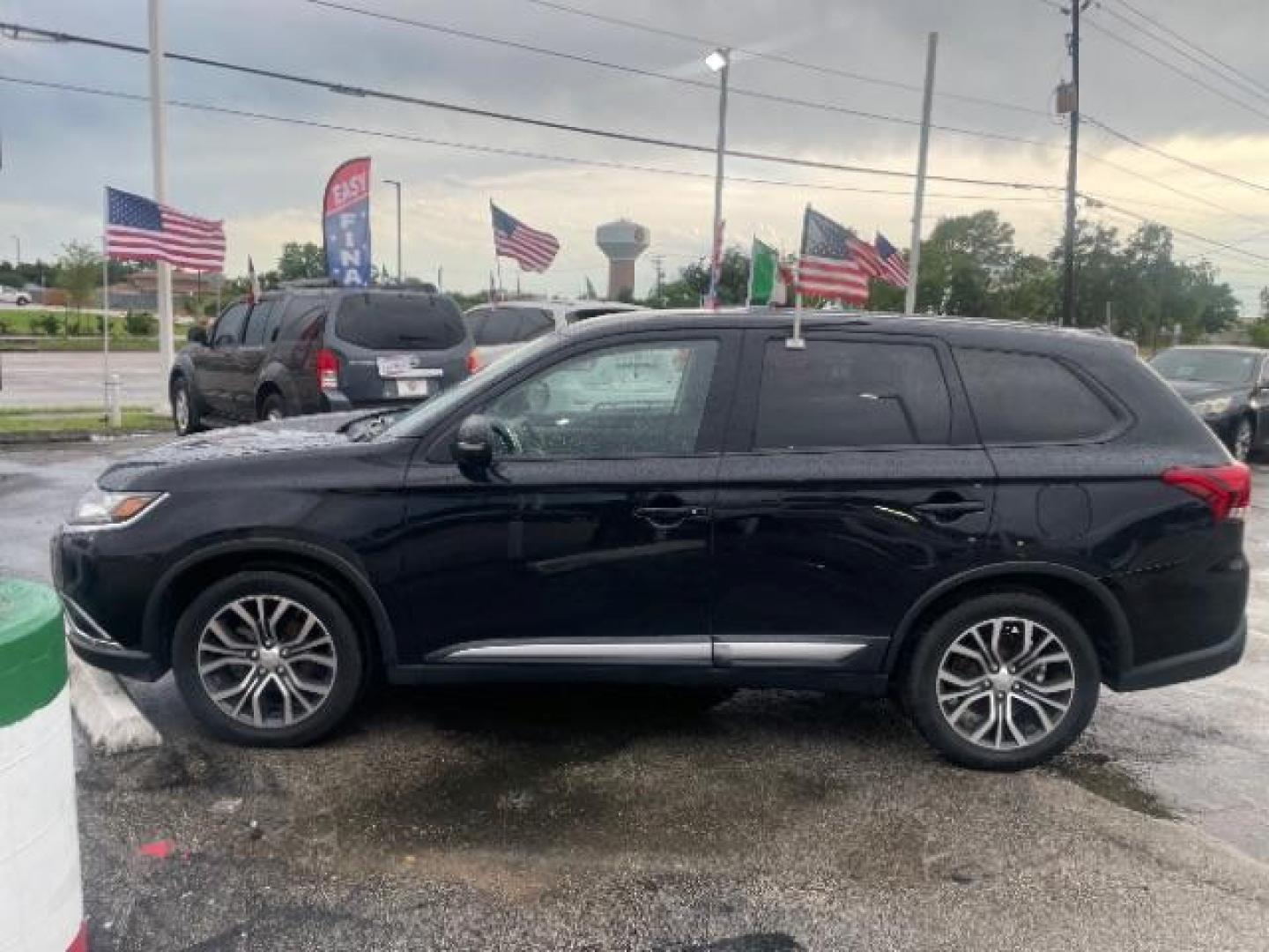 2016 Labrador Black /Black, cloth Mitsubishi Outlander SE 2WD (JA4AD3A30GZ) with an 2.4L L4 DOHC 16V engine, Continuously Variable Transmission transmission, located at 4545 Spencer Hwy., Pasadena, 77504, (832) 266-1645, 29.666037, -95.173775 - Photo#1