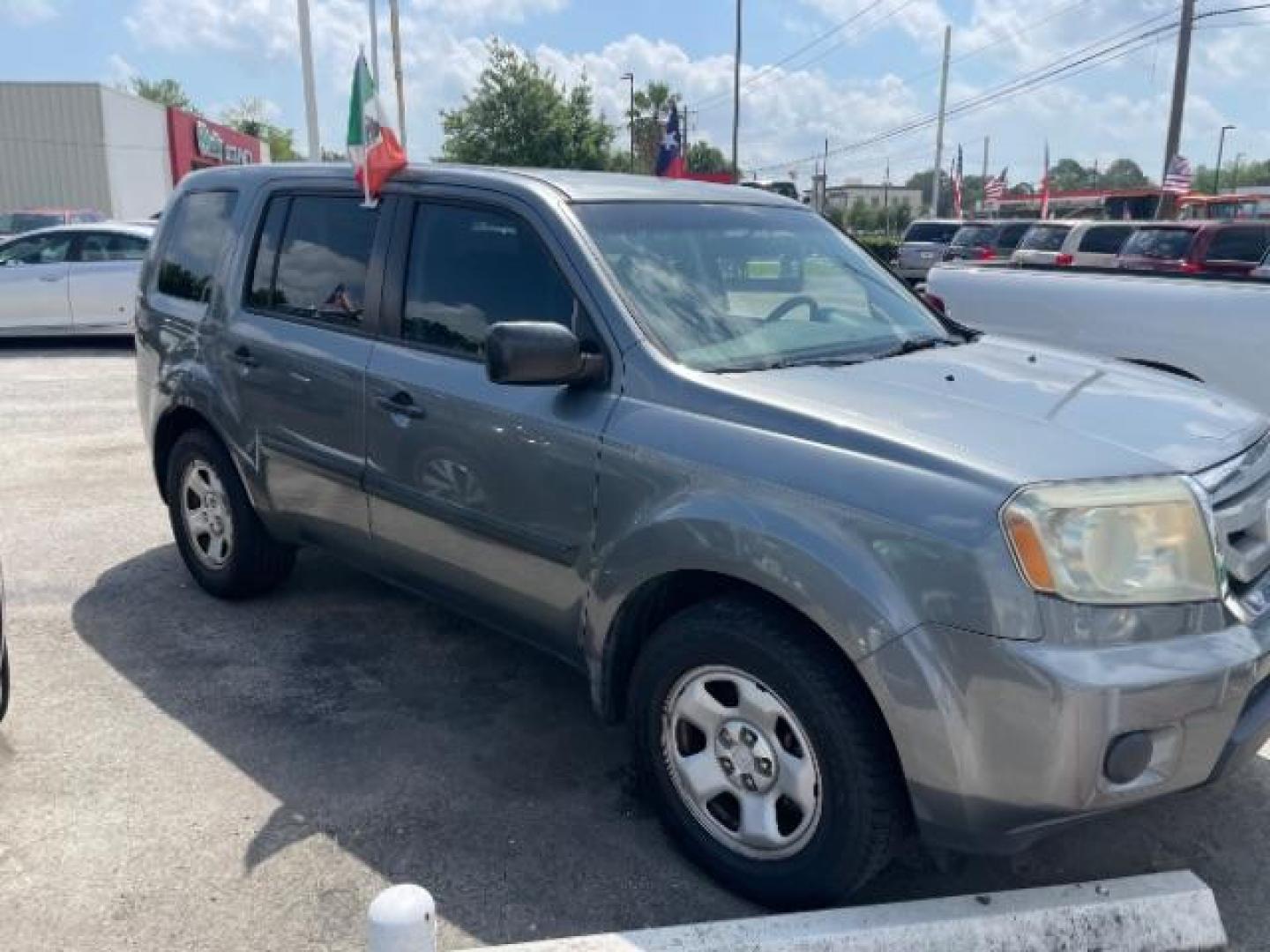 2009 Sterling Gray Metallic Honda Pilot LX 2WD (5FNYF38249B) with an 3.5L V6 SOHC 24V engine, 5-Speed Automatic transmission, located at 4545 Spencer Hwy., Pasadena, 77504, (832) 266-1645, 29.666037, -95.173775 - Photo#2