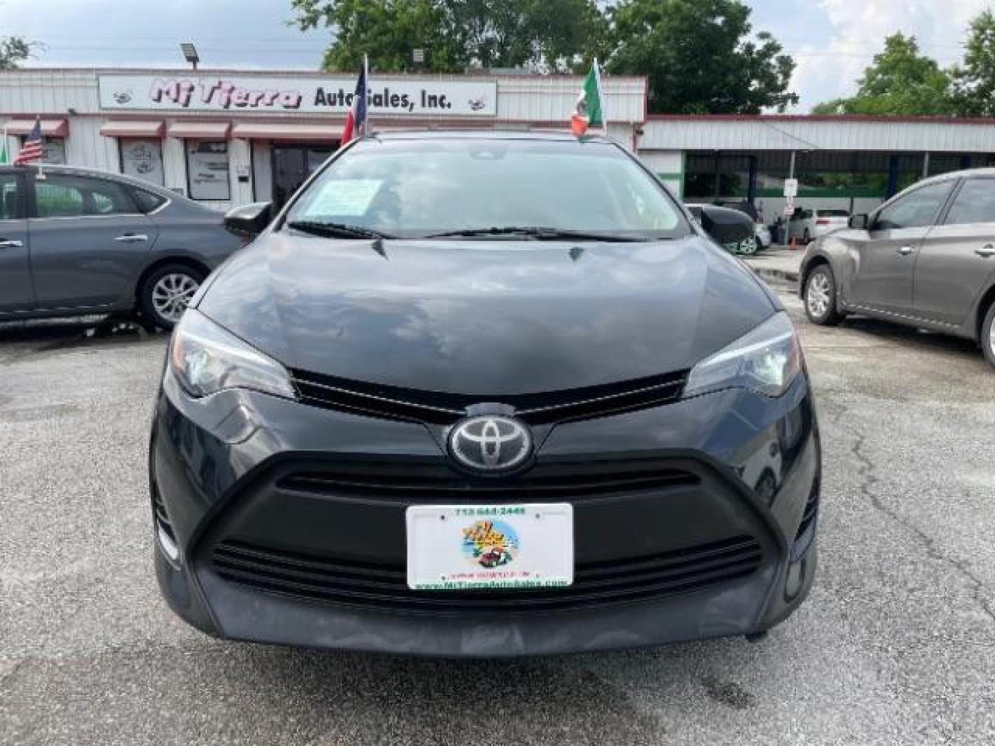 2017 Black Sand Pearl /Black/Brown Fabric, premium cloth Toyota Corolla LE CVT (2T1BURHE3HC) with an 1.8L L4 DOHC 16V engine, Continuously Variable Transmission transmission, located at 4545 Spencer Hwy., Pasadena, 77504, (832) 266-1645, 29.666037, -95.173775 - Photo#0