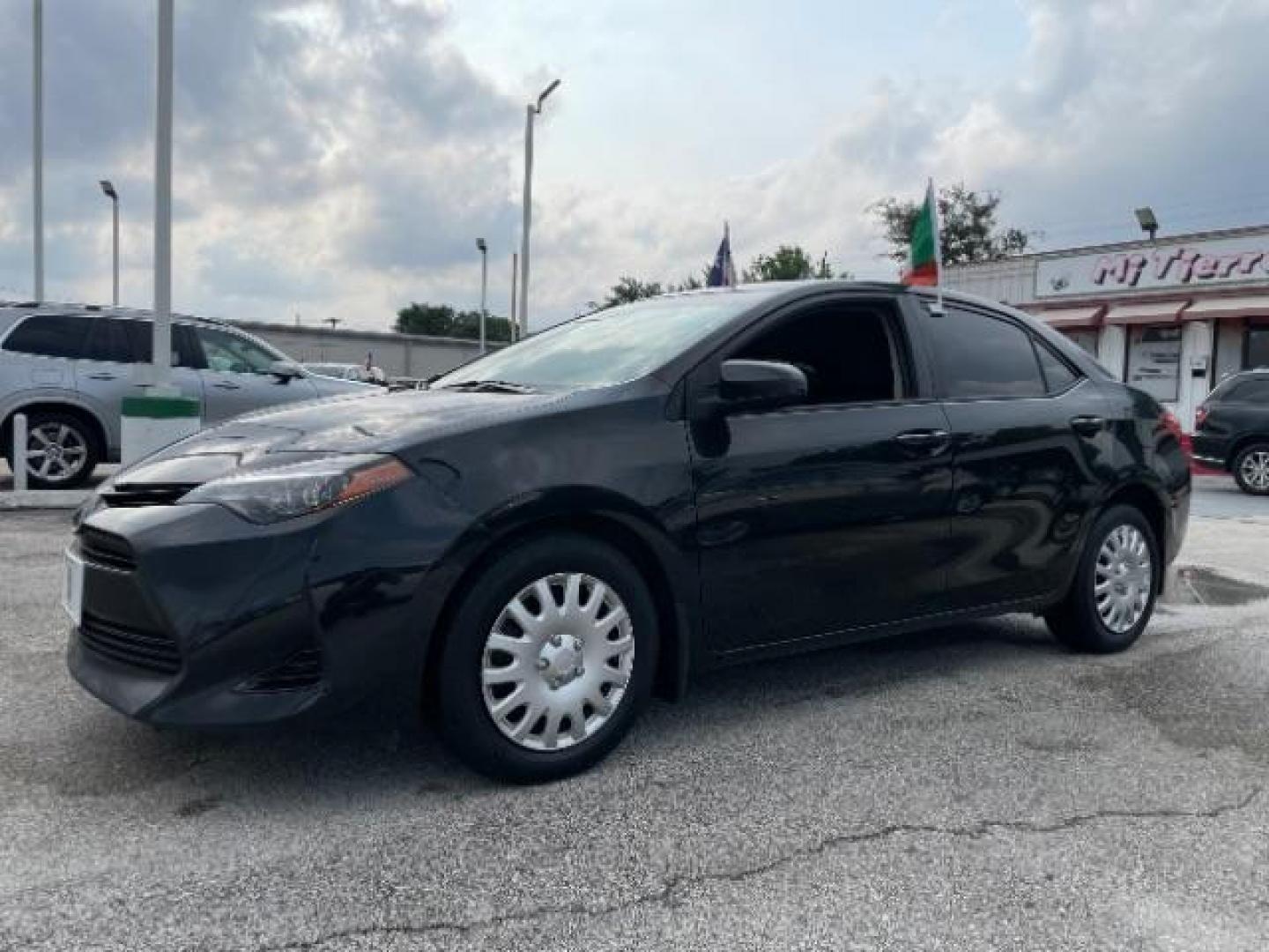 2017 Black Sand Pearl /Black/Brown Fabric, premium cloth Toyota Corolla LE CVT (2T1BURHE3HC) with an 1.8L L4 DOHC 16V engine, Continuously Variable Transmission transmission, located at 4545 Spencer Hwy., Pasadena, 77504, (832) 266-1645, 29.666037, -95.173775 - Photo#1