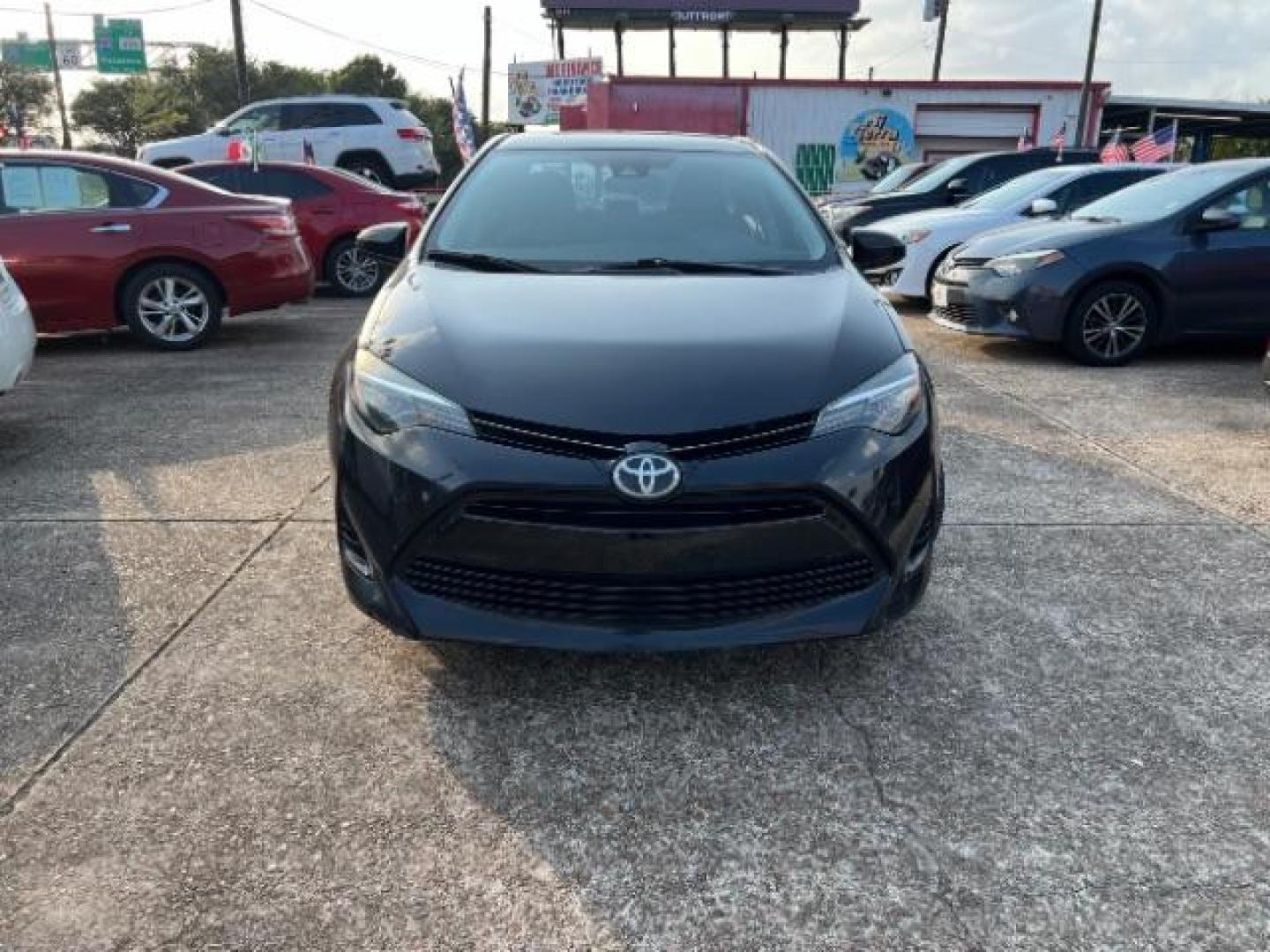 2017 Black Sand Pearl /Ash/Dark Gray Fabric, premium cloth Toyota Corolla LE CVT (5YFBURHE5HP) with an 1.8L L4 DOHC 16V engine, Continuously Variable Transmission transmission, located at 7935 Gulf Freeway, Houston, 77017, (832) 266-1645, 29.684393, -95.275665 - Photo#1