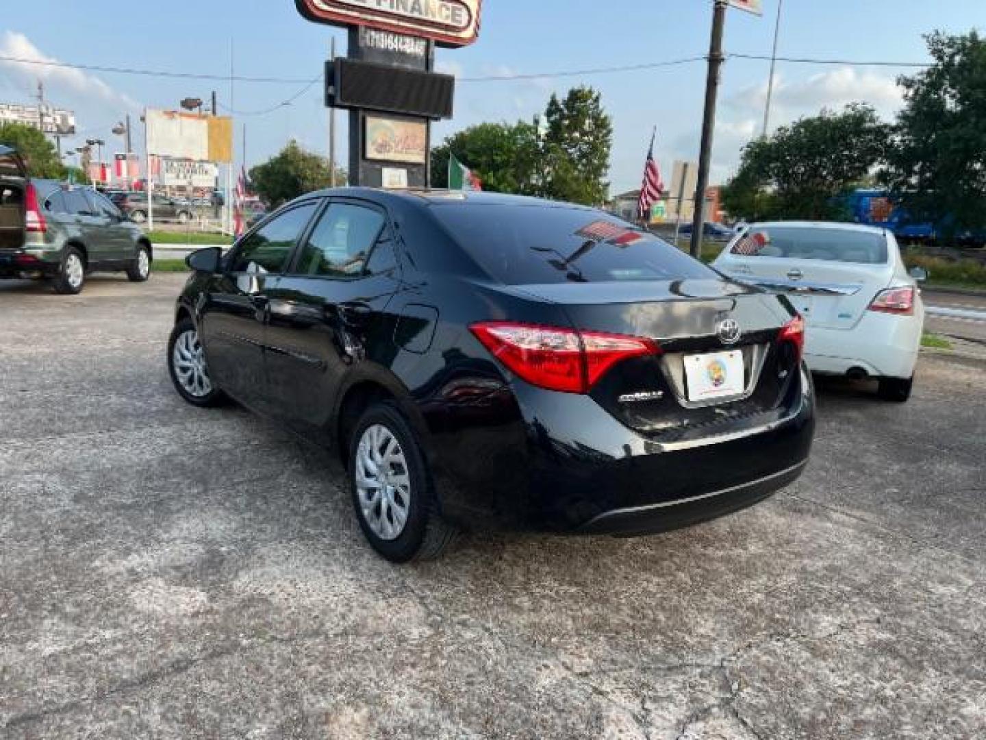 2017 Black Sand Pearl /Ash/Dark Gray Fabric, premium cloth Toyota Corolla LE CVT (5YFBURHE5HP) with an 1.8L L4 DOHC 16V engine, Continuously Variable Transmission transmission, located at 7935 Gulf Freeway, Houston, 77017, (832) 266-1645, 29.684393, -95.275665 - Photo#4