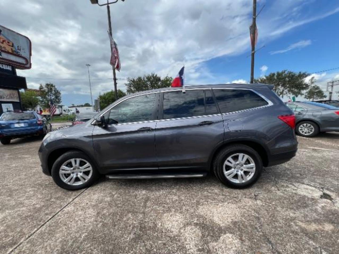 2017 Steel Sapphire Metallic Honda Pilot LX 2WD (5FNYF5H12HB) with an 3.5L V6 SOHC 24V engine, 6-Speed Automatic transmission, located at 7935 Gulf Freeway, Houston, 77017, (832) 266-1645, 29.684393, -95.275665 - Photo#3