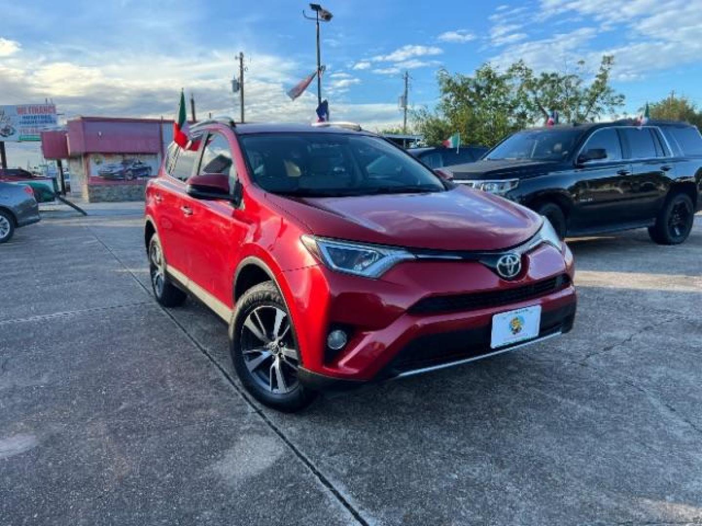 2016 Barcelona Red Metallic Toyota RAV4 XLE FWD (2T3WFREV9GW) with an 2.5L L4 DOHC 16V engine, 6-Speed Automatic transmission, located at 7935 Gulf Freeway, Houston, 77017, (832) 266-1645, 29.684393, -95.275665 - Photo#0