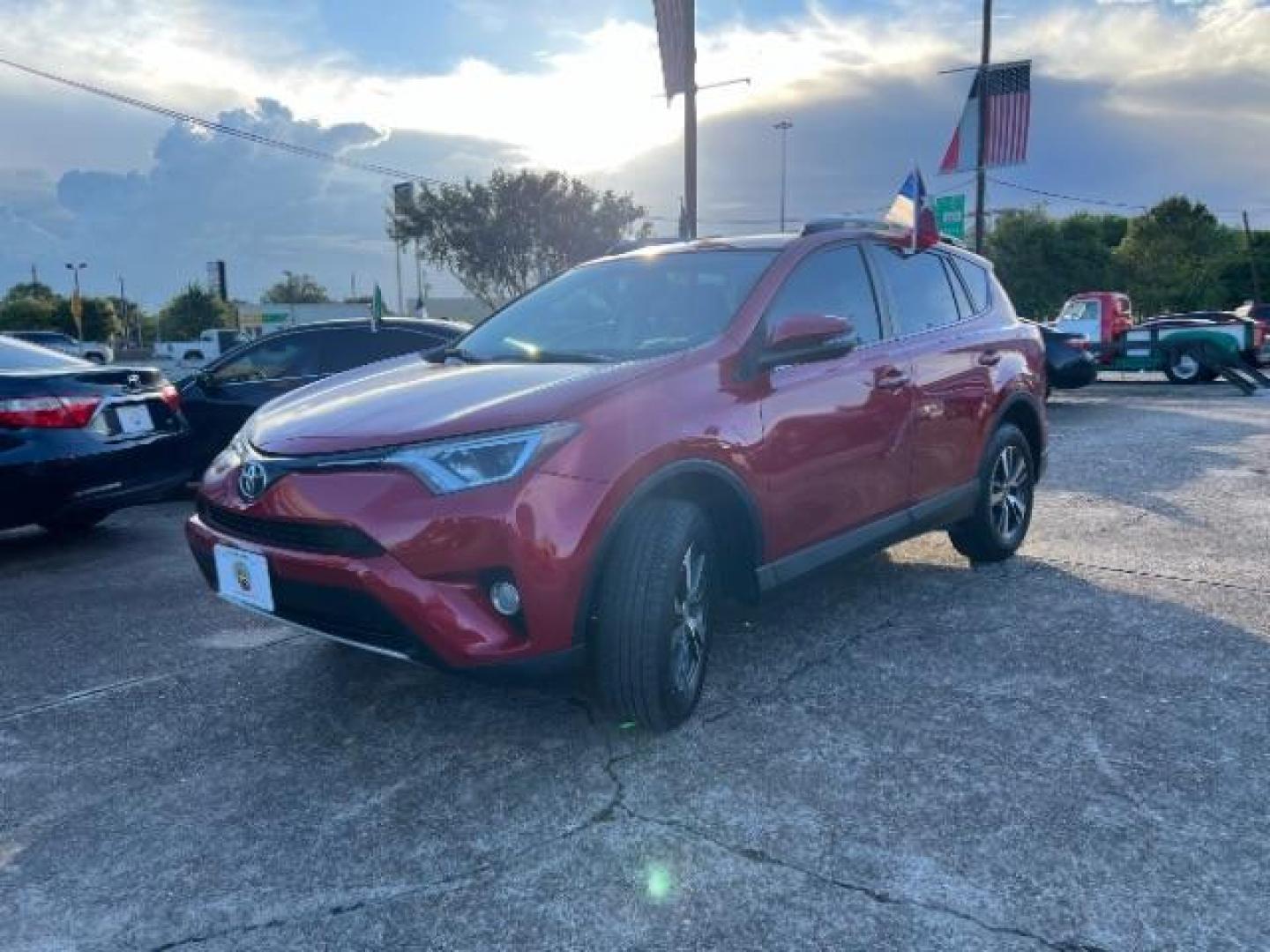 2016 Barcelona Red Metallic Toyota RAV4 XLE FWD (2T3WFREV9GW) with an 2.5L L4 DOHC 16V engine, 6-Speed Automatic transmission, located at 7935 Gulf Freeway, Houston, 77017, (832) 266-1645, 29.684393, -95.275665 - Photo#2