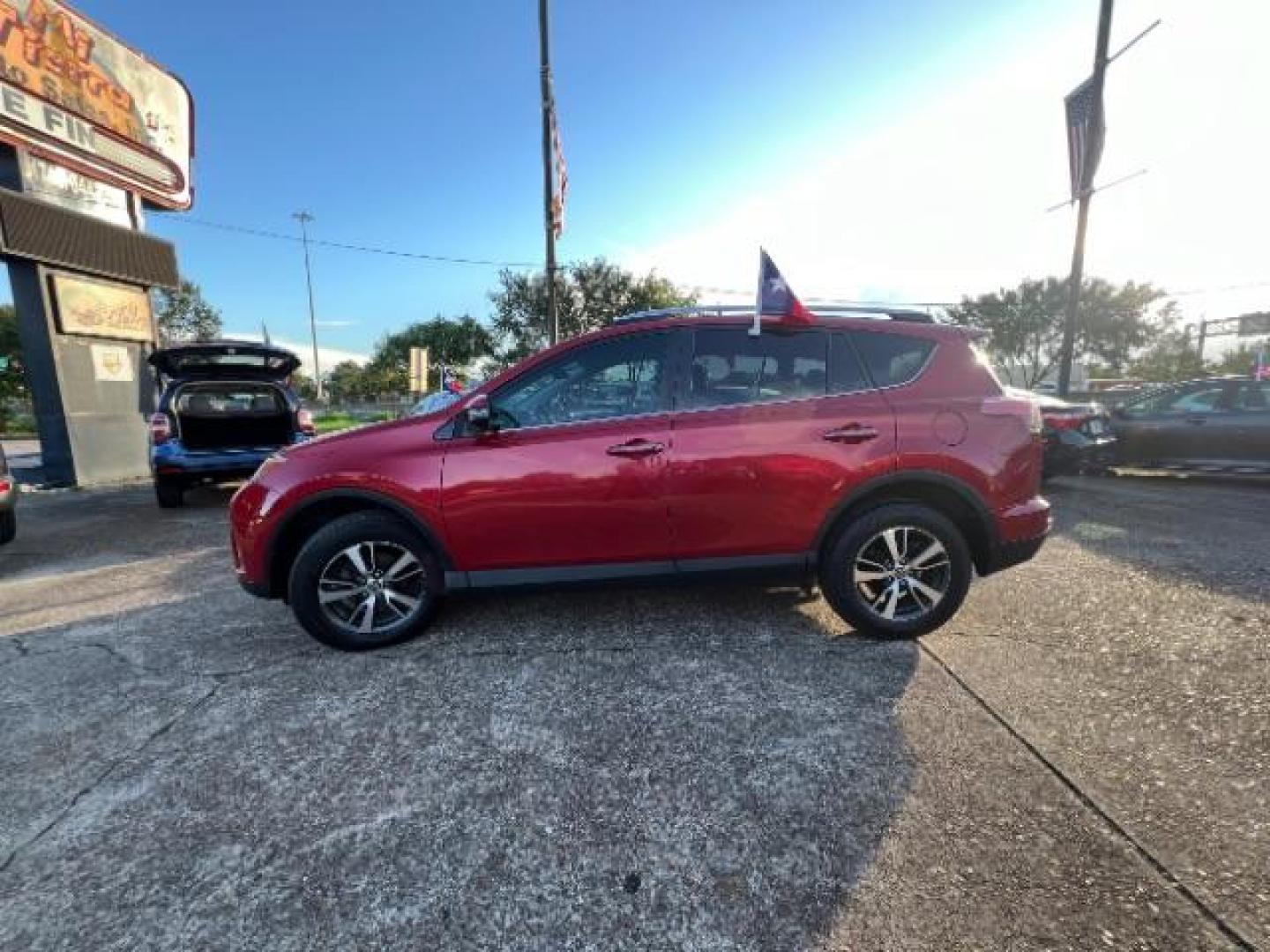 2016 Barcelona Red Metallic Toyota RAV4 XLE FWD (2T3WFREV9GW) with an 2.5L L4 DOHC 16V engine, 6-Speed Automatic transmission, located at 7935 Gulf Freeway, Houston, 77017, (832) 266-1645, 29.684393, -95.275665 - Photo#3