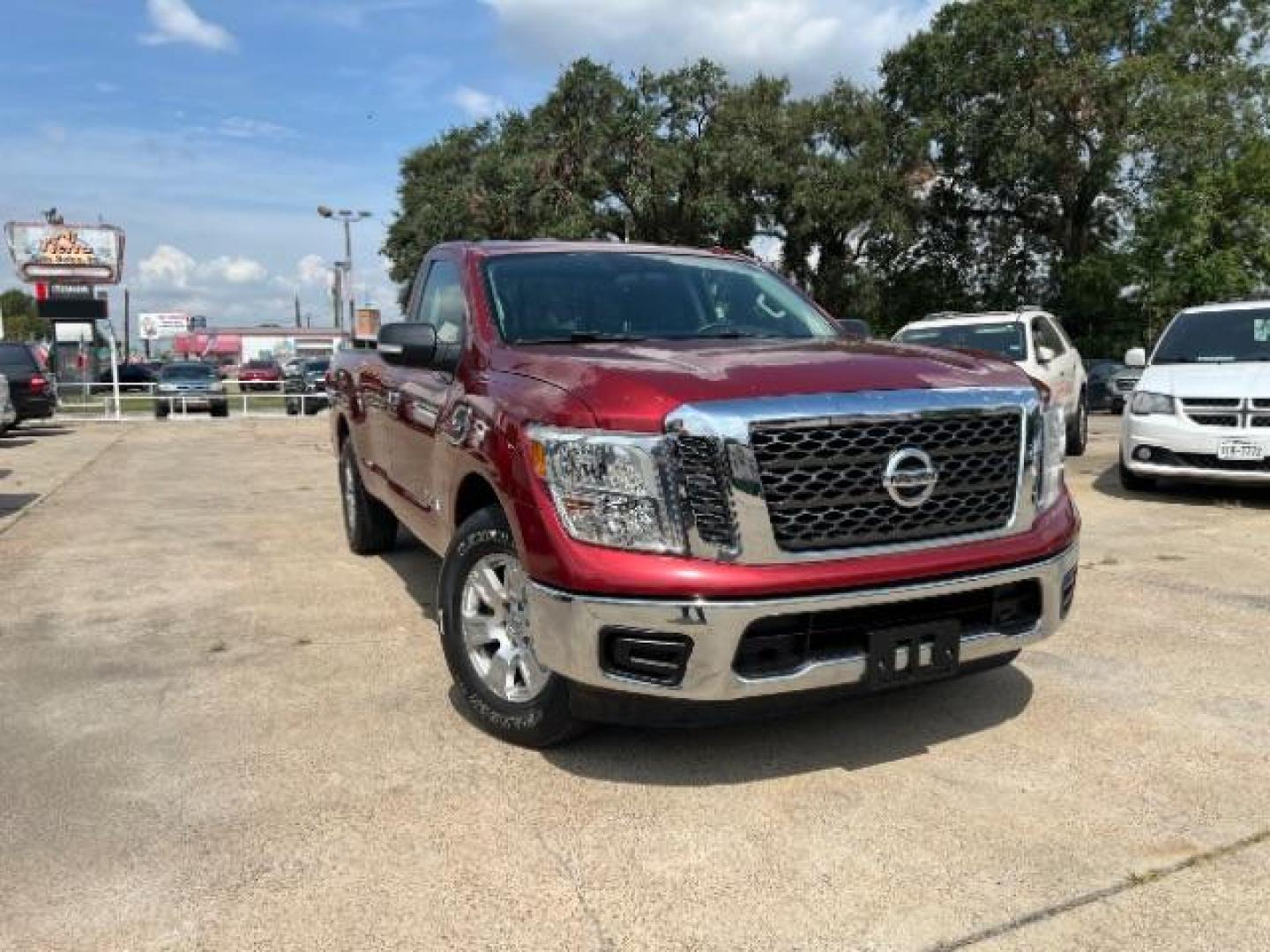 2017 Cayenne Red Nissan Titan SV Pickup 2D 8 ft (1N6AA1R79HN) with an 5.6L V8 DOHC 32V engine, 6-Speed Automatic transmission, located at 7935 Gulf Freeway, Houston, 77017, (832) 266-1645, 29.684393, -95.275665 - Photo#0