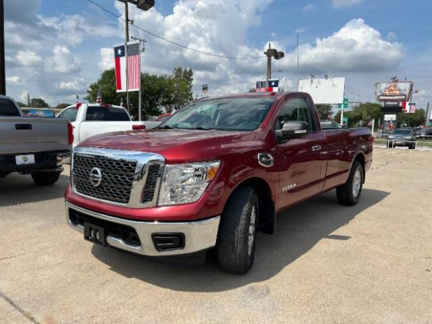 2017 Cayenne Red Nissan Titan SV Pickup 2D 8 ft (1N6AA1R79HN) with an 5.6L V8 DOHC 32V engine, 6-Speed Automatic transmission, located at 7935 Gulf Freeway, Houston, 77017, (832) 266-1645, 29.684393, -95.275665 - Photo#2