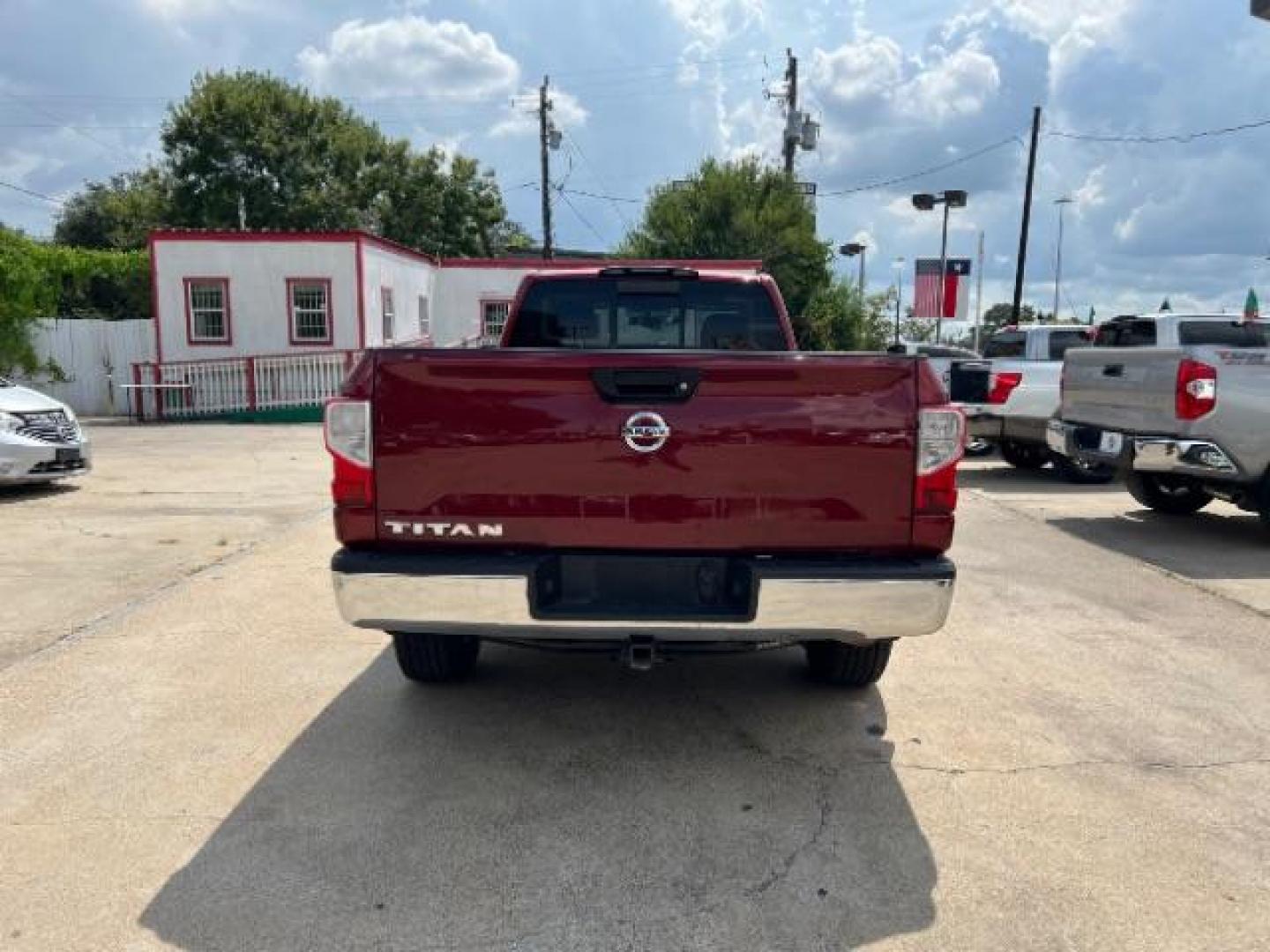 2017 Cayenne Red Nissan Titan SV Pickup 2D 8 ft (1N6AA1R79HN) with an 5.6L V8 DOHC 32V engine, 6-Speed Automatic transmission, located at 7935 Gulf Freeway, Houston, 77017, (832) 266-1645, 29.684393, -95.275665 - Photo#5