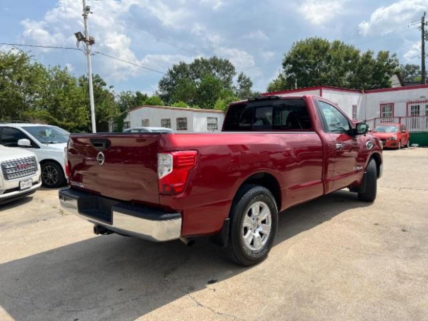 2017 Cayenne Red Nissan Titan SV Pickup 2D 8 ft (1N6AA1R79HN) with an 5.6L V8 DOHC 32V engine, 6-Speed Automatic transmission, located at 7935 Gulf Freeway, Houston, 77017, (832) 266-1645, 29.684393, -95.275665 - Photo#6