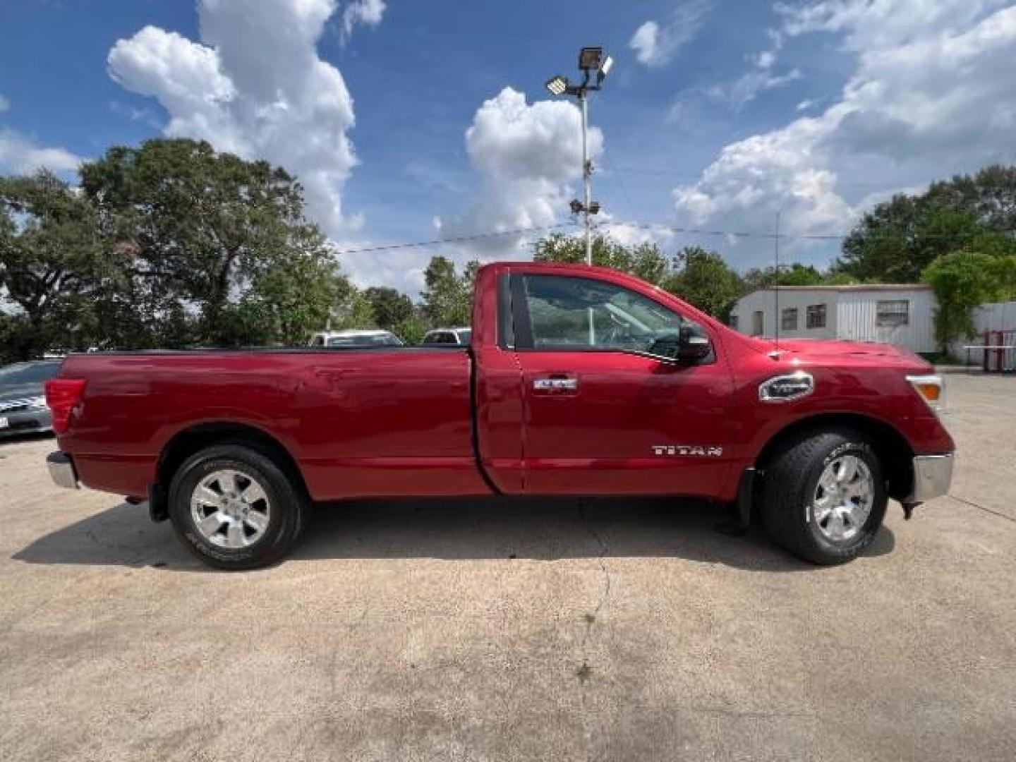 2017 Cayenne Red Nissan Titan SV Pickup 2D 8 ft (1N6AA1R79HN) with an 5.6L V8 DOHC 32V engine, 6-Speed Automatic transmission, located at 7935 Gulf Freeway, Houston, 77017, (832) 266-1645, 29.684393, -95.275665 - Photo#7