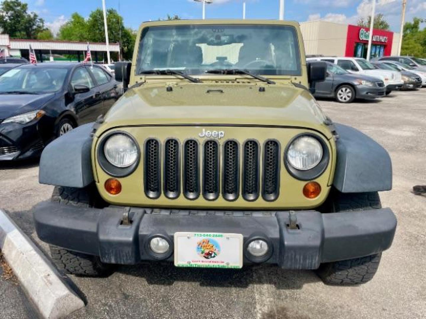 2013 OLIVE GREEN Jeep Wrangler Unlimited Sport 4WD (1C4BJWDG0DL) with an 3.6L V6 DOHC 24V FFV engine, located at 4545 Spencer Hwy., Pasadena, 77504, (832) 266-1645, 29.666037, -95.173775 - Photo#1