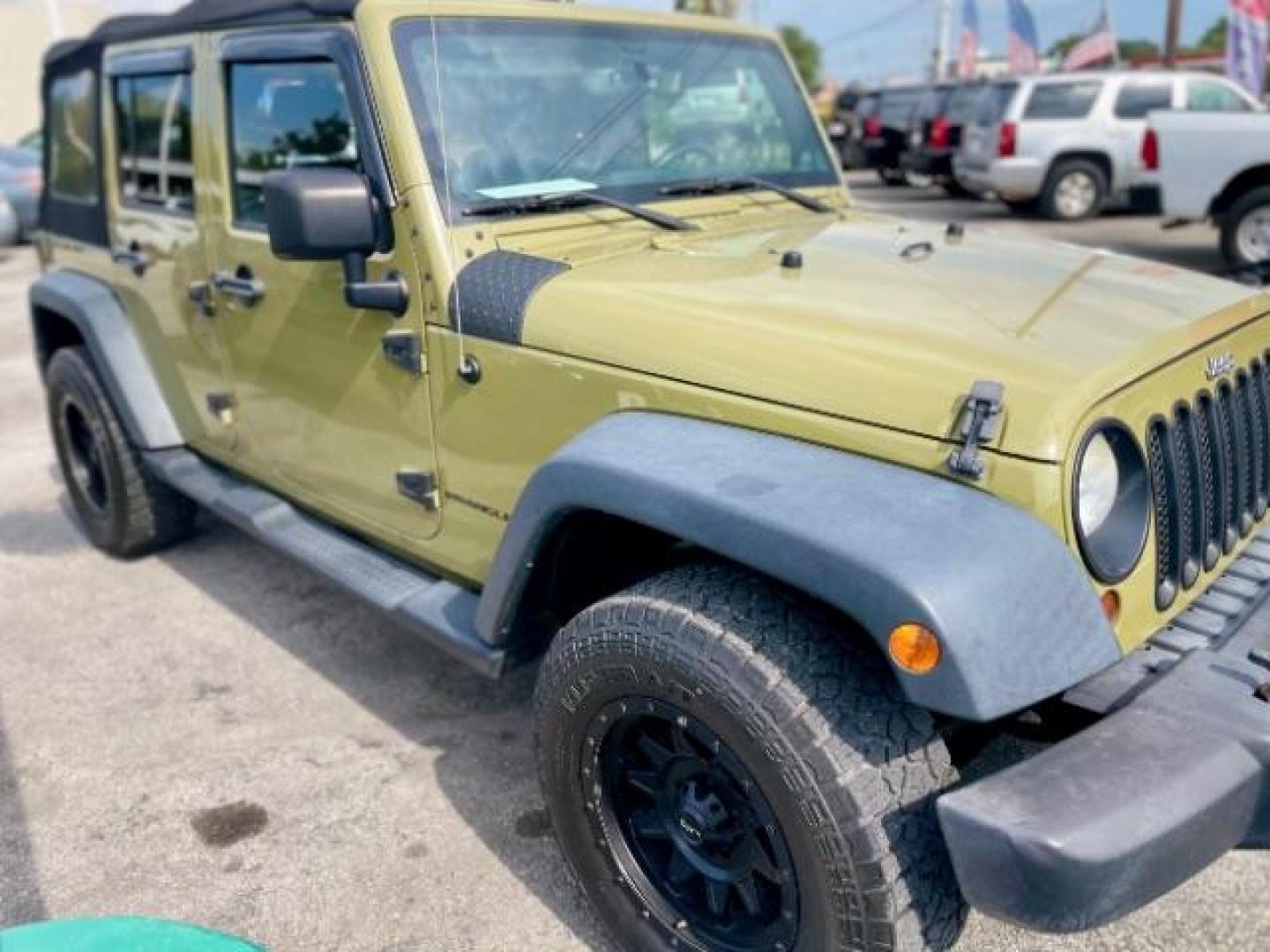 2013 OLIVE GREEN Jeep Wrangler Unlimited Sport 4WD (1C4BJWDG0DL) with an 3.6L V6 DOHC 24V FFV engine, located at 4545 Spencer Hwy., Pasadena, 77504, (832) 266-1645, 29.666037, -95.173775 - Photo#2