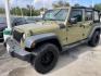 2013 OLIVE GREEN Jeep Wrangler Unlimited Sport 4WD (1C4BJWDG0DL) with an 3.6L V6 DOHC 24V FFV engine, located at 4545 Spencer Hwy., Pasadena, 77504, (832) 266-1645, 29.666037, -95.173775 - Photo#3