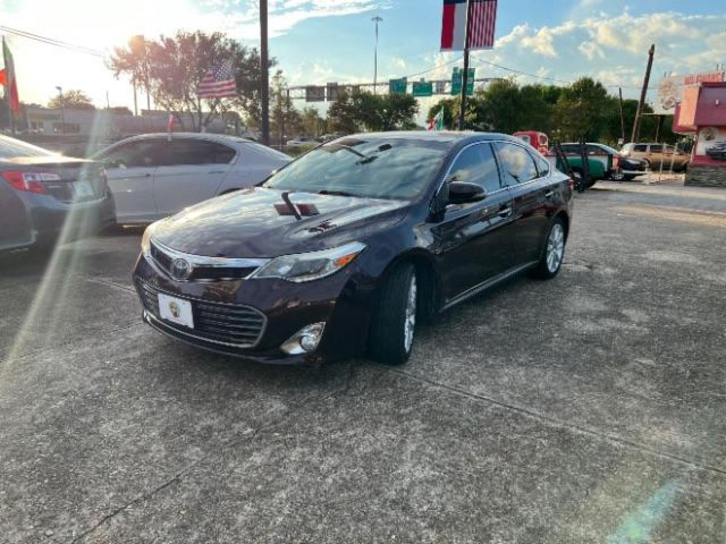 2015 Sizzling Crimson Mica Toyota Avalon Limited (4T1BK1EB6FU) with an 3.5L V6 DOHC 24V engine, 6-Speed Automatic transmission, located at 7935 Gulf Freeway, Houston, 77017, (832) 266-1645, 29.684393, -95.275665 - Photo#2