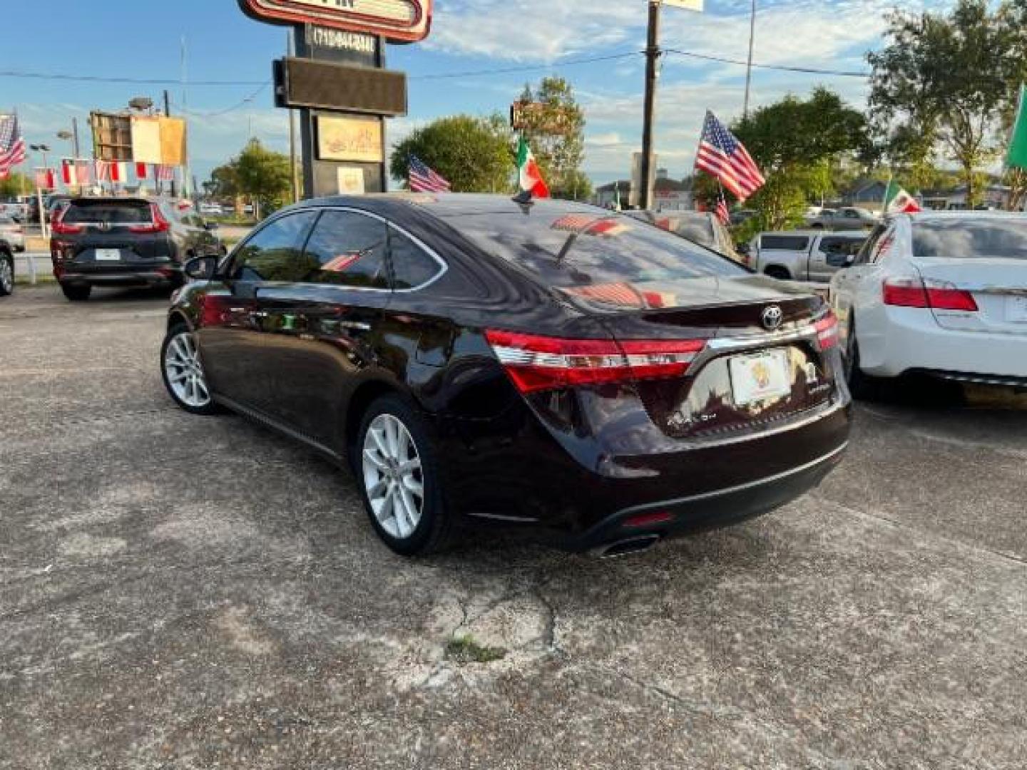 2015 Sizzling Crimson Mica Toyota Avalon Limited (4T1BK1EB6FU) with an 3.5L V6 DOHC 24V engine, 6-Speed Automatic transmission, located at 7935 Gulf Freeway, Houston, 77017, (832) 266-1645, 29.684393, -95.275665 - Photo#4