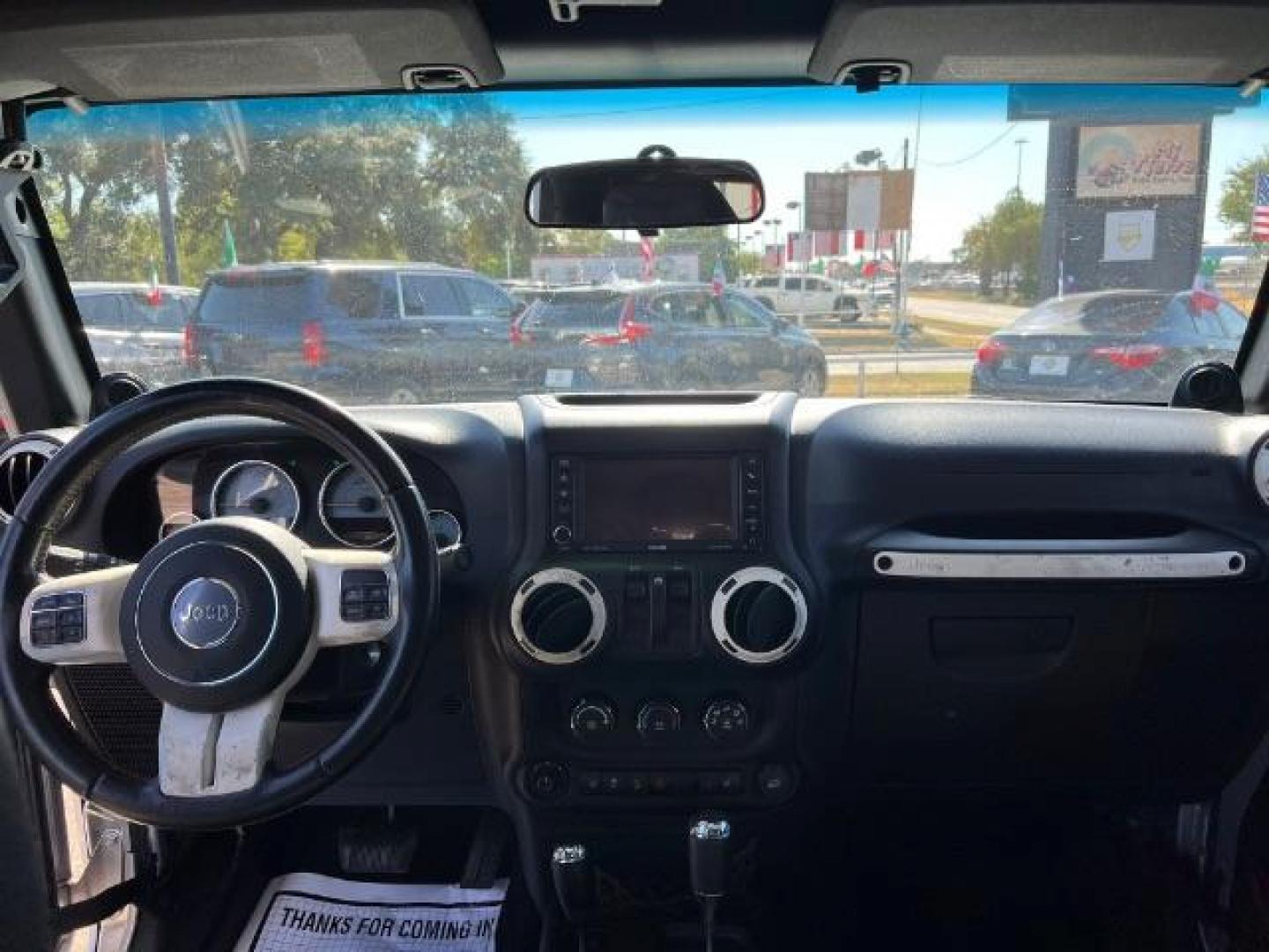 2012 Bright Silver Metallic with Black Soft Top Jeep Wrangler Sahara 4WD (1C4AJWBG1CL) with an 3.6L V6 DOHC 24V FFV engine, 5-Speed Automatic transmission, located at 7935 Gulf Freeway, Houston, 77017, (832) 266-1645, 29.684393, -95.275665 - Photo#12