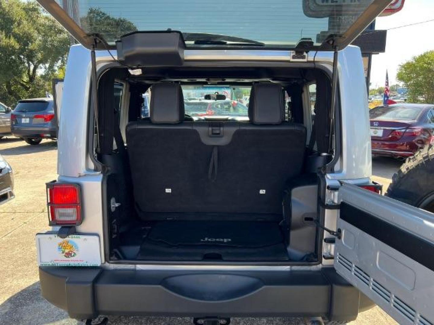 2012 Bright Silver Metallic with Black Soft Top Jeep Wrangler Sahara 4WD (1C4AJWBG1CL) with an 3.6L V6 DOHC 24V FFV engine, 5-Speed Automatic transmission, located at 7935 Gulf Freeway, Houston, 77017, (832) 266-1645, 29.684393, -95.275665 - Photo#13