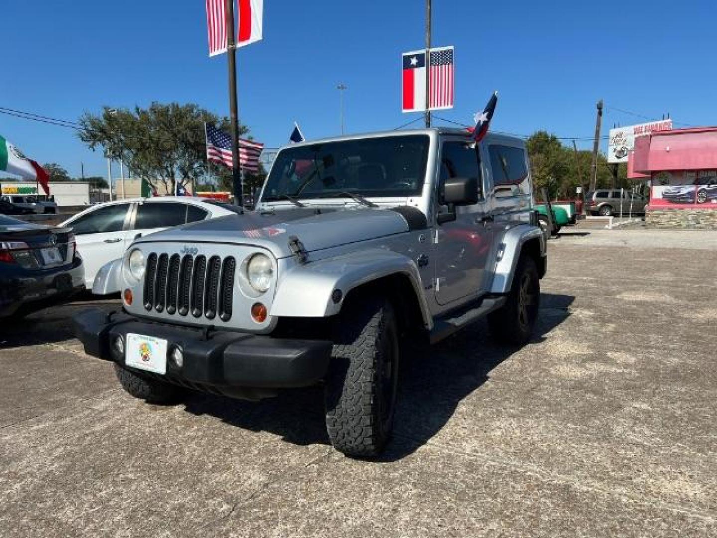 2012 Bright Silver Metallic with Black Soft Top Jeep Wrangler Sahara 4WD (1C4AJWBG1CL) with an 3.6L V6 DOHC 24V FFV engine, 5-Speed Automatic transmission, located at 7935 Gulf Freeway, Houston, 77017, (832) 266-1645, 29.684393, -95.275665 - Photo#2