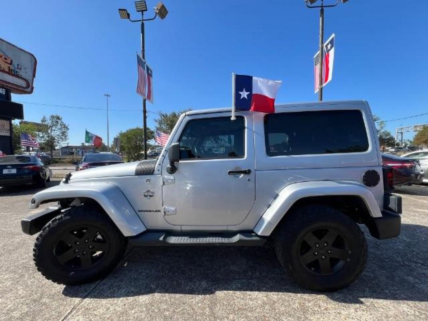 2012 Bright Silver Metallic with Black Soft Top Jeep Wrangler Sahara 4WD (1C4AJWBG1CL) with an 3.6L V6 DOHC 24V FFV engine, 5-Speed Automatic transmission, located at 7935 Gulf Freeway, Houston, 77017, (832) 266-1645, 29.684393, -95.275665 - Photo#3