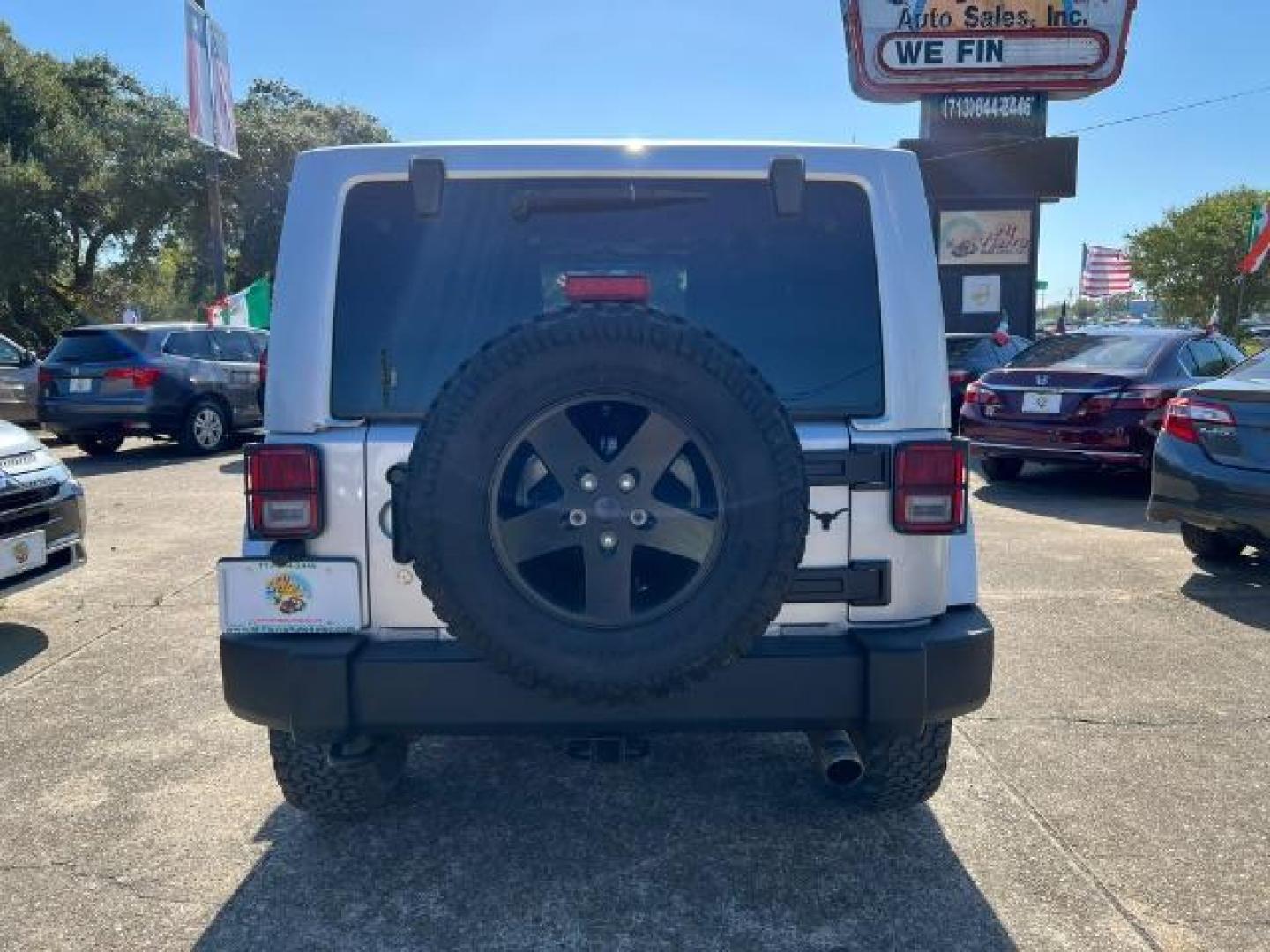 2012 Bright Silver Metallic with Black Soft Top Jeep Wrangler Sahara 4WD (1C4AJWBG1CL) with an 3.6L V6 DOHC 24V FFV engine, 5-Speed Automatic transmission, located at 7935 Gulf Freeway, Houston, 77017, (832) 266-1645, 29.684393, -95.275665 - Photo#5