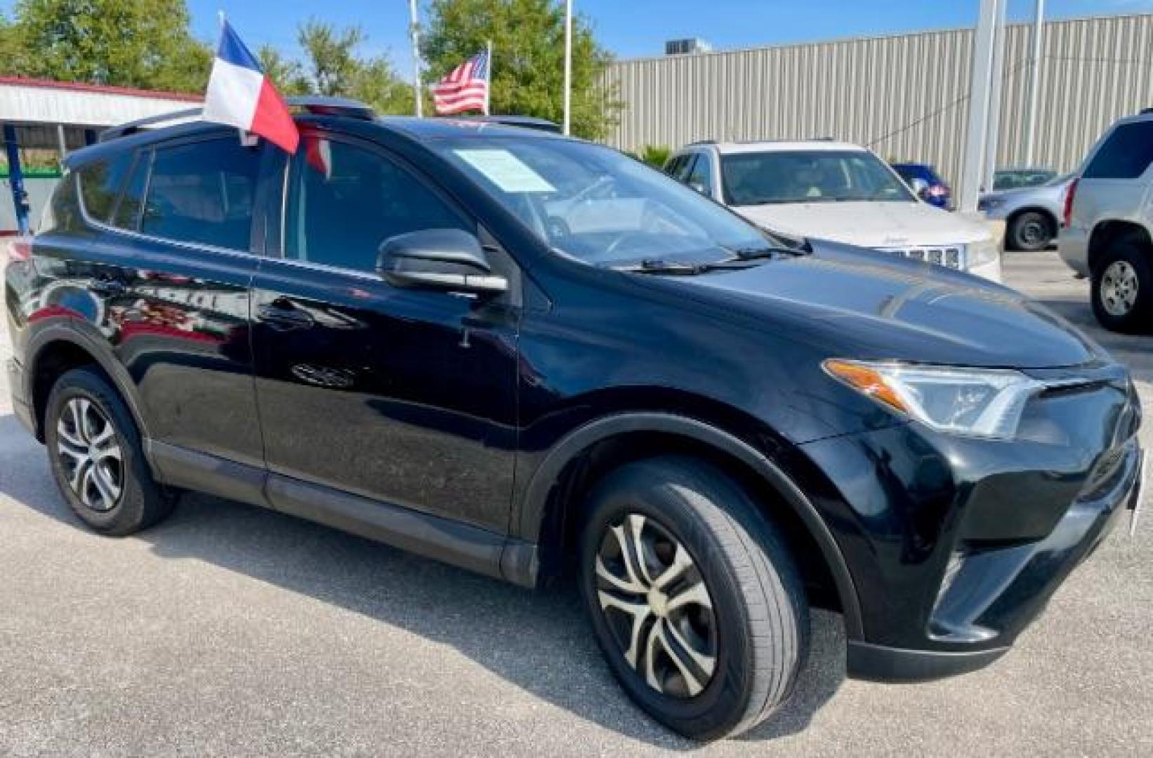 2018 Black Currant Metallic /Black, cloth Toyota RAV4 LE FWD (2T3ZFREV2JW) with an 2.5L L4 DOHC 16V engine, 6-Speed Automatic transmission, located at 4545 Spencer Hwy., Pasadena, 77504, (832) 266-1645, 29.666037, -95.173775 - Photo#2