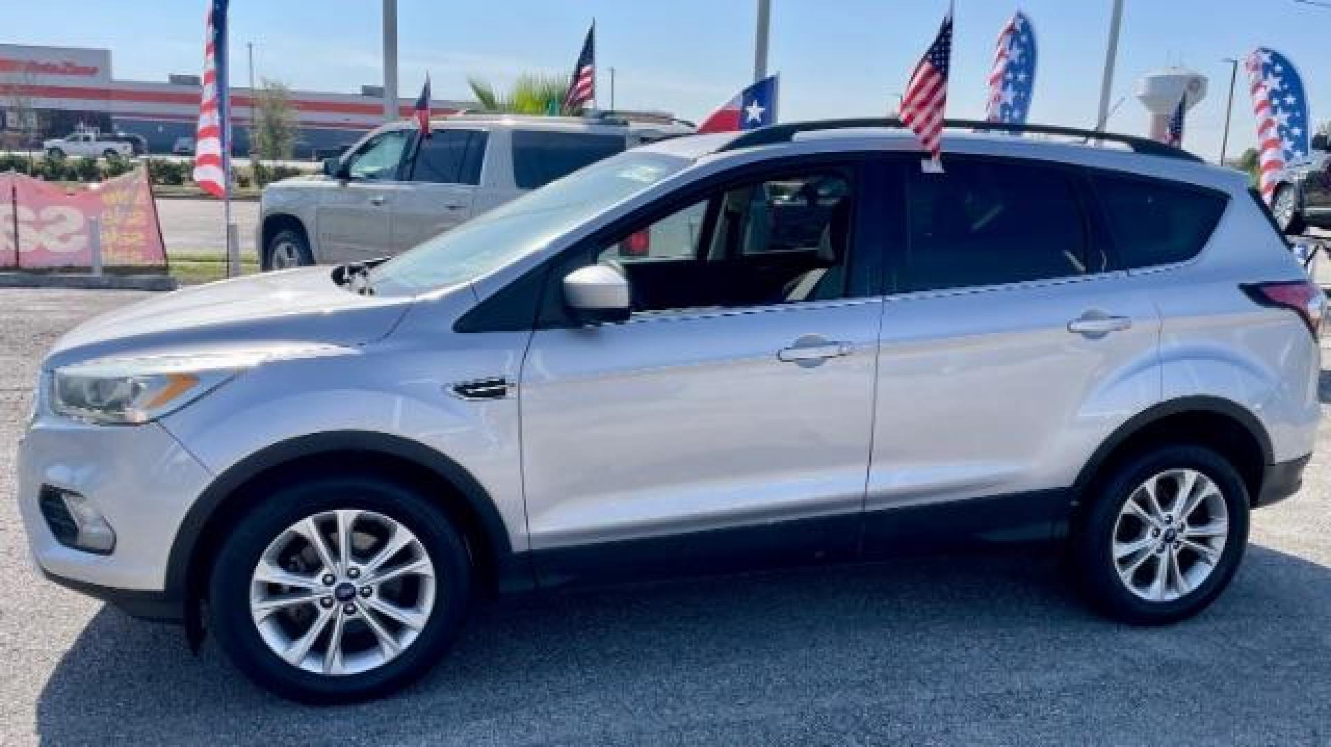 2017 Ingot Silver Metallic /Medium Light Stone, cloth Ford Escape SE FWD (1FMCU0GD5HU) with an 1.5L L4 DOHC 16V engine, 6-Speed Automatic transmission, located at 4545 Spencer Hwy., Pasadena, 77504, (832) 266-1645, 29.666037, -95.173775 - Photo#1