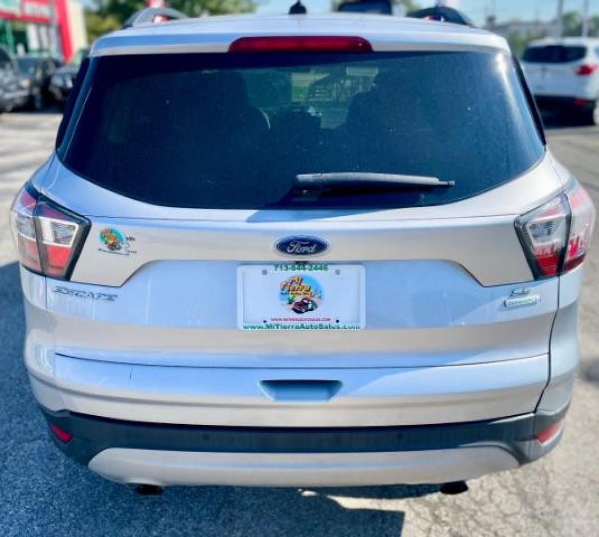 2017 Ingot Silver Metallic /Medium Light Stone, cloth Ford Escape SE FWD (1FMCU0GD5HU) with an 1.5L L4 DOHC 16V engine, 6-Speed Automatic transmission, located at 4545 Spencer Hwy., Pasadena, 77504, (832) 266-1645, 29.666037, -95.173775 - Photo#3