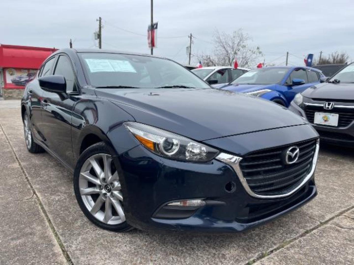 2017 Deep Crystal Blue Mica Mazda Mazda3 Touring Hatchback 4D (3MZBN1L75HM) with an 2.0 engine, Automatic transmission, located at 7935 Gulf Freeway, Houston, 77017, (832) 266-1645, 29.684393, -95.275665 - Photo#0