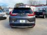 2017 Gunmetal Metallic /Gray Honda CR-V EX Sport Utility 4D (2HKRW1H59HH) with an 1.5 engine, Continuously Variable Transmission transmission, located at 7935 Gulf Freeway, Houston, 77017, (832) 266-1645, 29.684393, -95.275665 - Photo#5